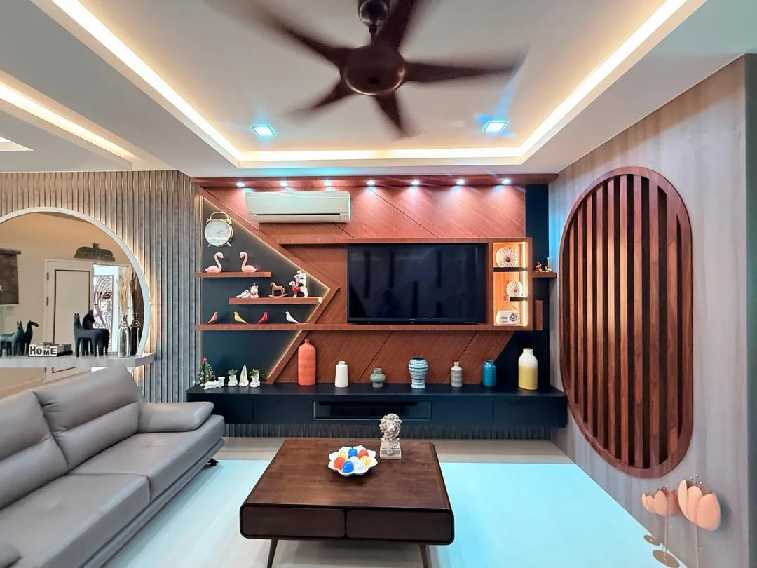 Completed living room with sculptural timber feature wall, built-in display shelving and circular mirror