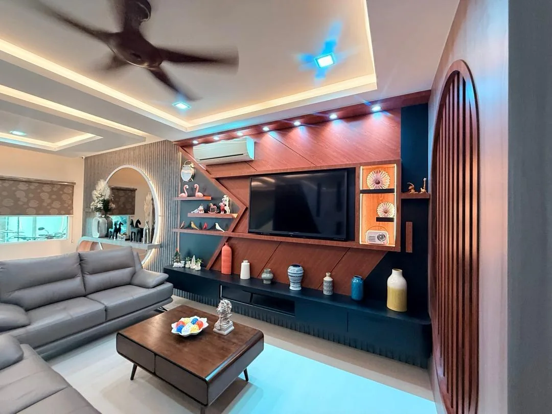 Completed living room with a custom TV console, display cabinetry and decorative wall treatment