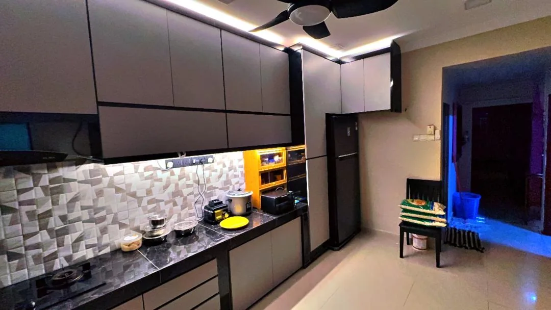 Renovated kitchen with new grey cabinetry and integrated lighting