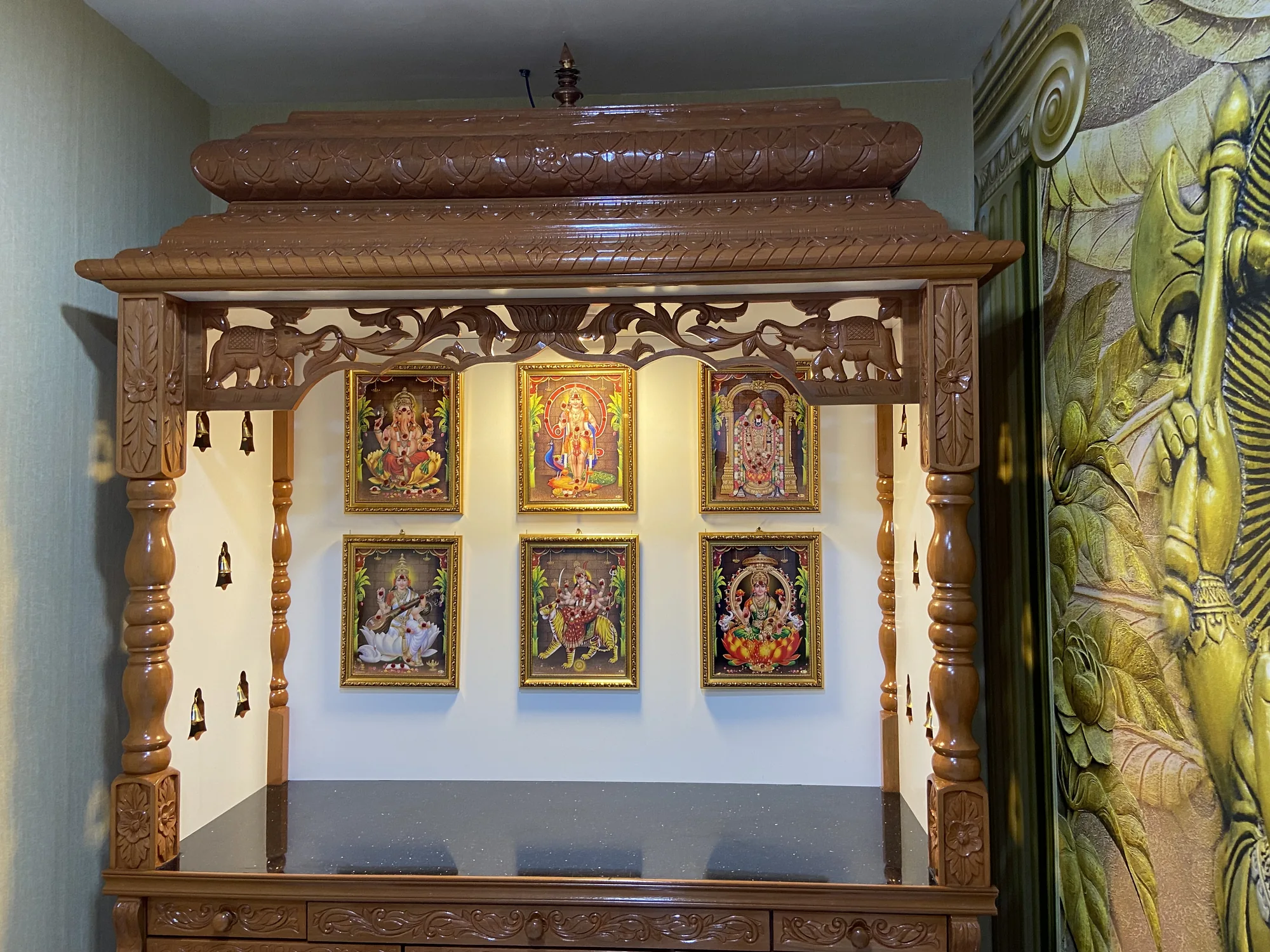Hand-carved timber prayer unit with illuminated framed alcoves