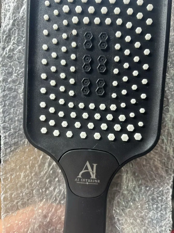 Close detail of matte black rain shower head