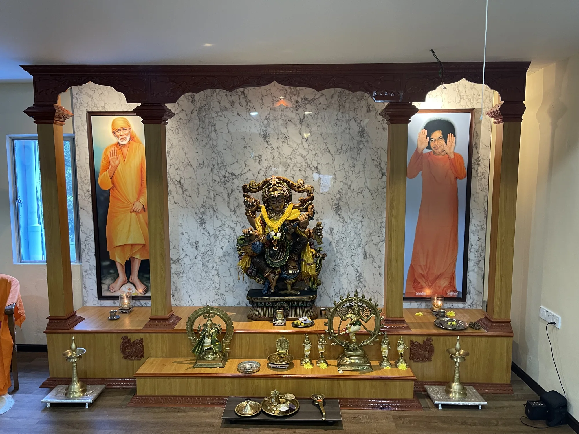 Bespoke timber sacred room installation with marble-look backdrop